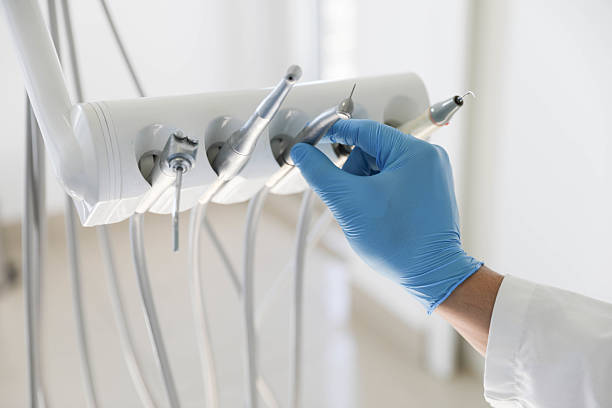 Professional Tooth Extraction technician working in Golden Gate, FL